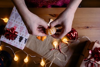 Person Holding a Orange Fruit