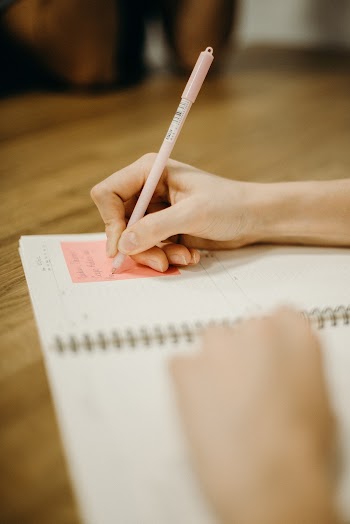 Person Holding a Pen