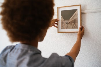 Person Holding A Picture Frame