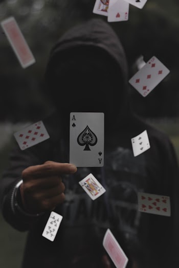 Person Holding A Playing Car