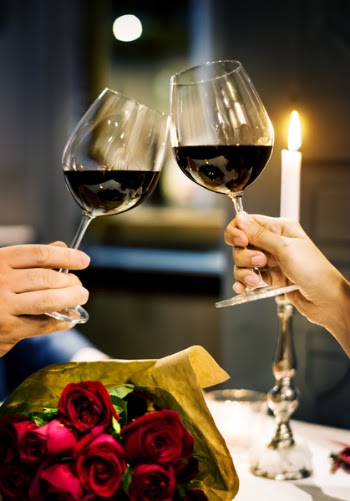 Person Holding a Wine Glasses