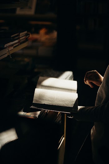 Person Holding an Open Book