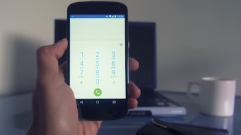Person Holding Android Smartphone Displaying Dial Application