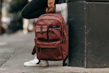 Person Holding Backpack
