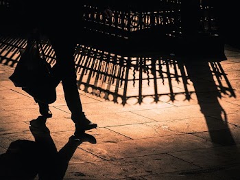 person holding bag while walking