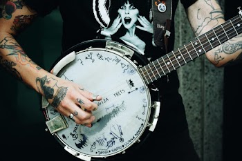 Person Holding Banjo