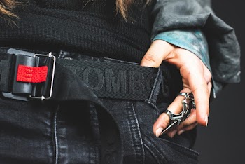 Person Holding Black Belt