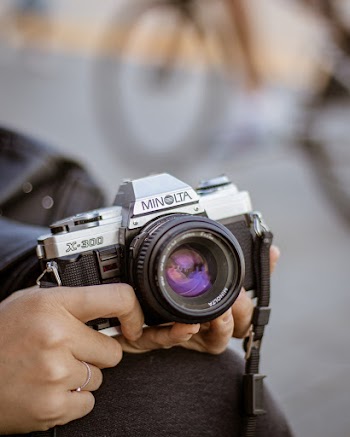 Person Holding Black Camera