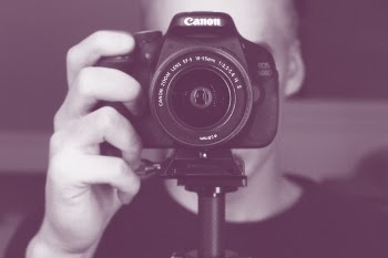 Person Holding Black Canon Eos 600d