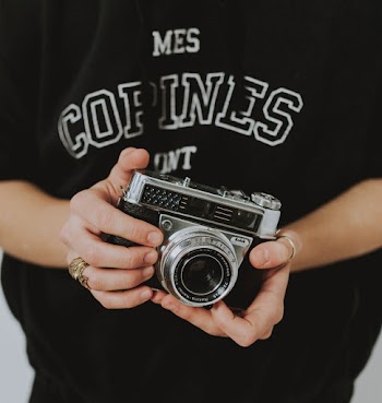 Person Holding Black Dslr Camera