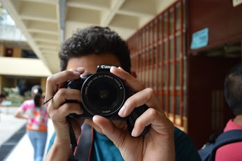 Person Holding Black Dslr Camera