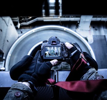 Person Holding Black Dslr Camera