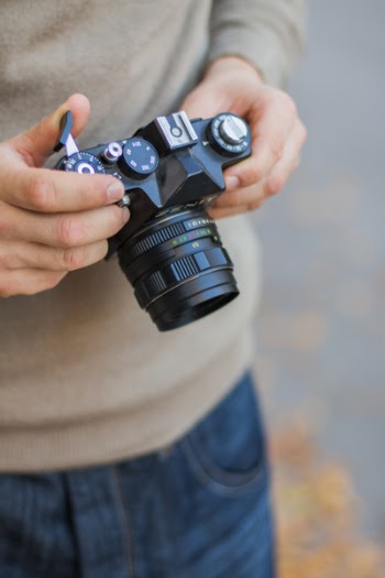 Person Holding Black Dslr Camera