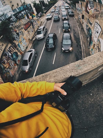 Person Holding Black Dslr Camera