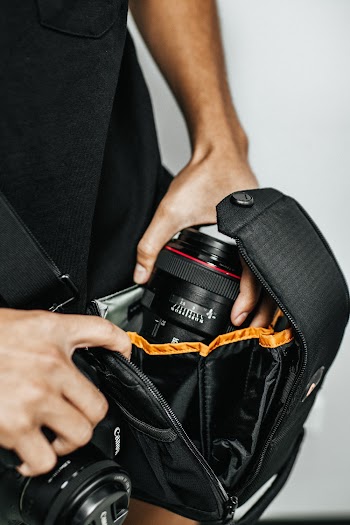 Person Holding Black Dslr Camera