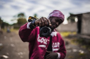 Person Holding Black Dslr Camera In Selective Focus Photography
