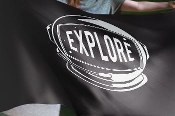 Person holding black explore flag | Free Photo - rawpixel