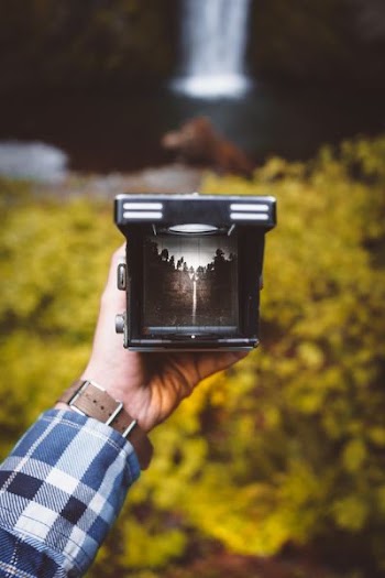 person holding black frame
