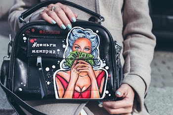 Person Holding Black Leather Bag