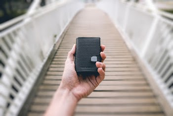 Person Holding Black Portable Speaker