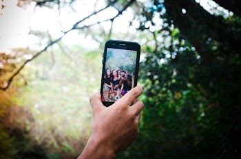 Person Holding Black Smartphone