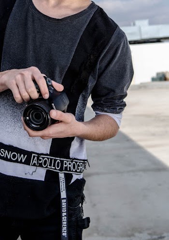 Person Holding Black Sony Dslr Camera