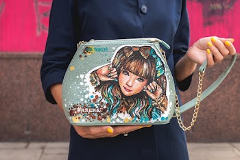 Person Holding Blue Crossbody Bag