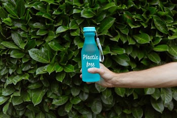 Person Holding Blue Water Bottle