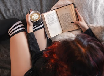 Person Holding Book and Mug