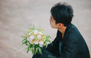 Person Holding Bouquet of Roses