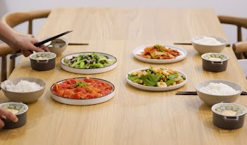 Person Holding Bowls