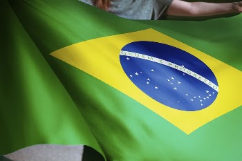 Person holding Brazilian flag background, | Free Photo - rawpixel