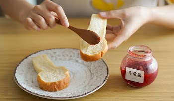 Person Holding Bread