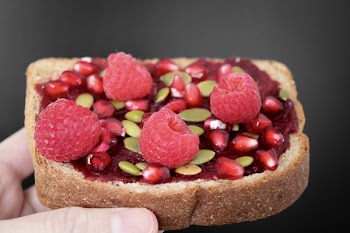 Person Holding Brown Bread With Strawberries