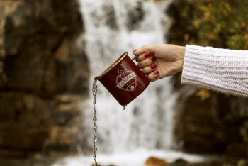 Person Holding Brown Mug