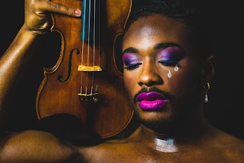 Person Holding Brown Violin