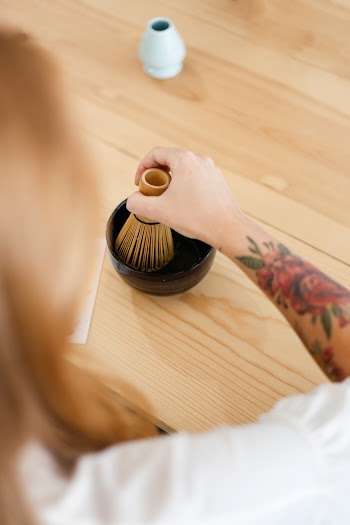 Person Holding Brown Wooden Tool
