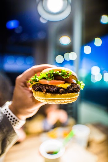 Person Holding Burger 
