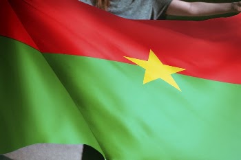 Person holding Burkina flag background, | Free Photo - rawpixel