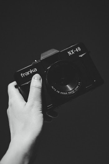 Person Holding Camera