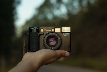 Person Holding Camera