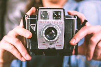 Person Holding Camera