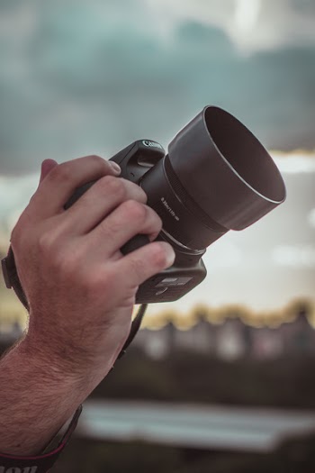 Person Holding Canon Dslr Camera
