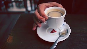 Person Holding Ceramic Cup