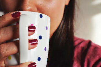 Person Holding Ceramic Mug