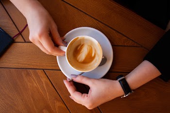 Person Holding Ceramic Mug