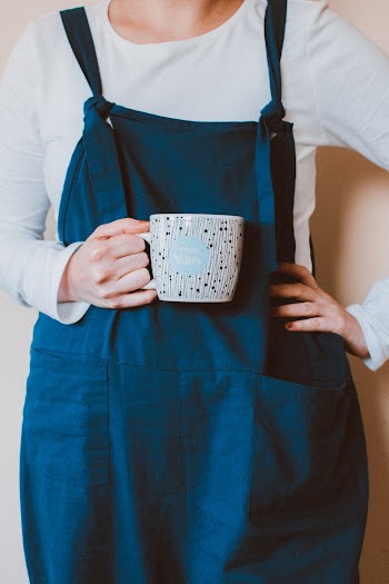 Person Holding Ceramic Mug