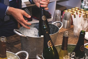 Person Holding Champagne Bottle