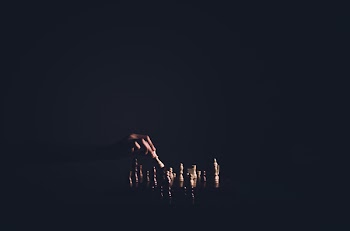 Person Holding Chess Piece