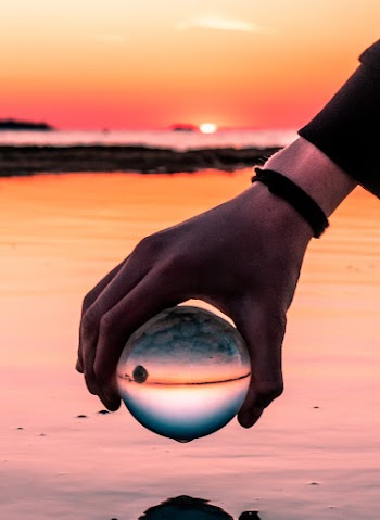 Person Holding Clear Ball
